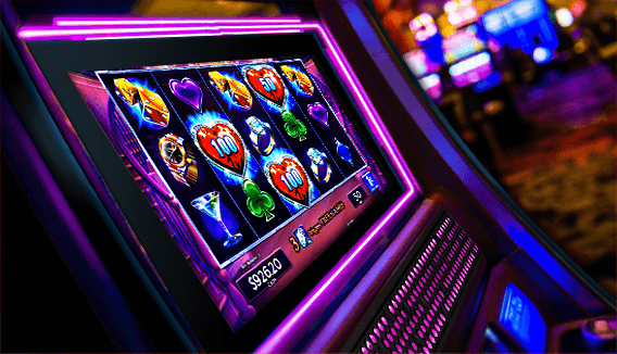 Slot machine with glowing purple lights