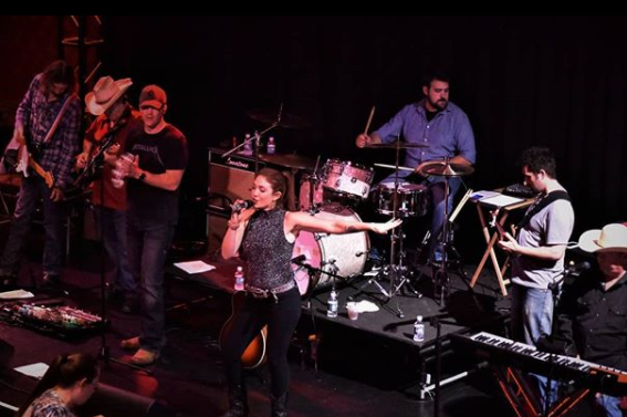 Sarah Winchester singing with band