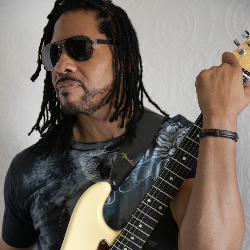 Scott Carter holding guitar
